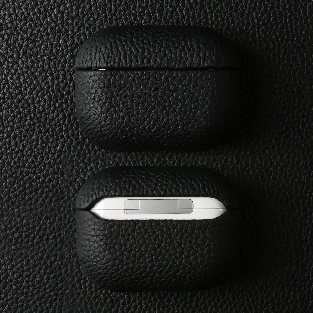 Cowhide leather AirPods case in obsidian black, front opening and charging slot