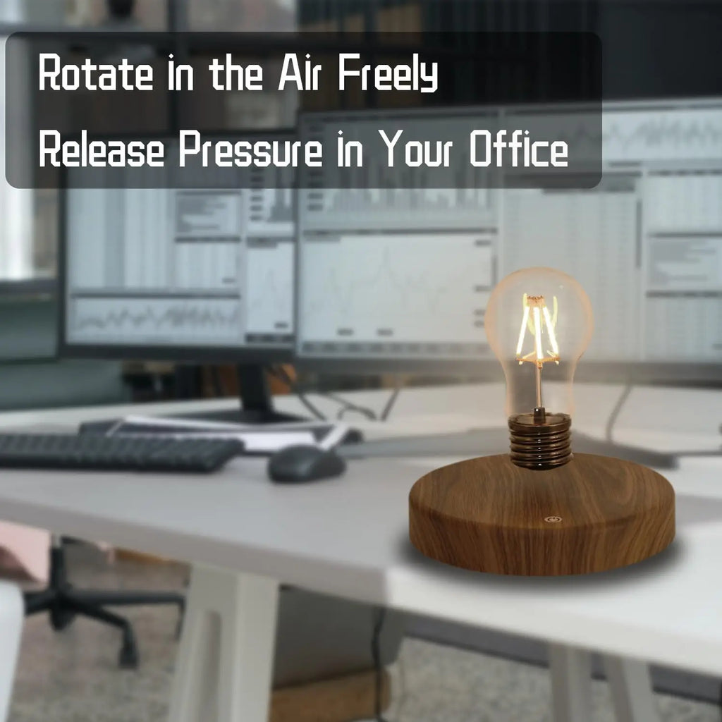 Glowing bulb lamp standing on round wooden base in office setting