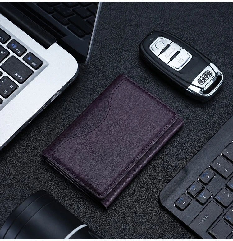 Magnetic pouch wallet in purple leather with stitched front flap, slim card holder