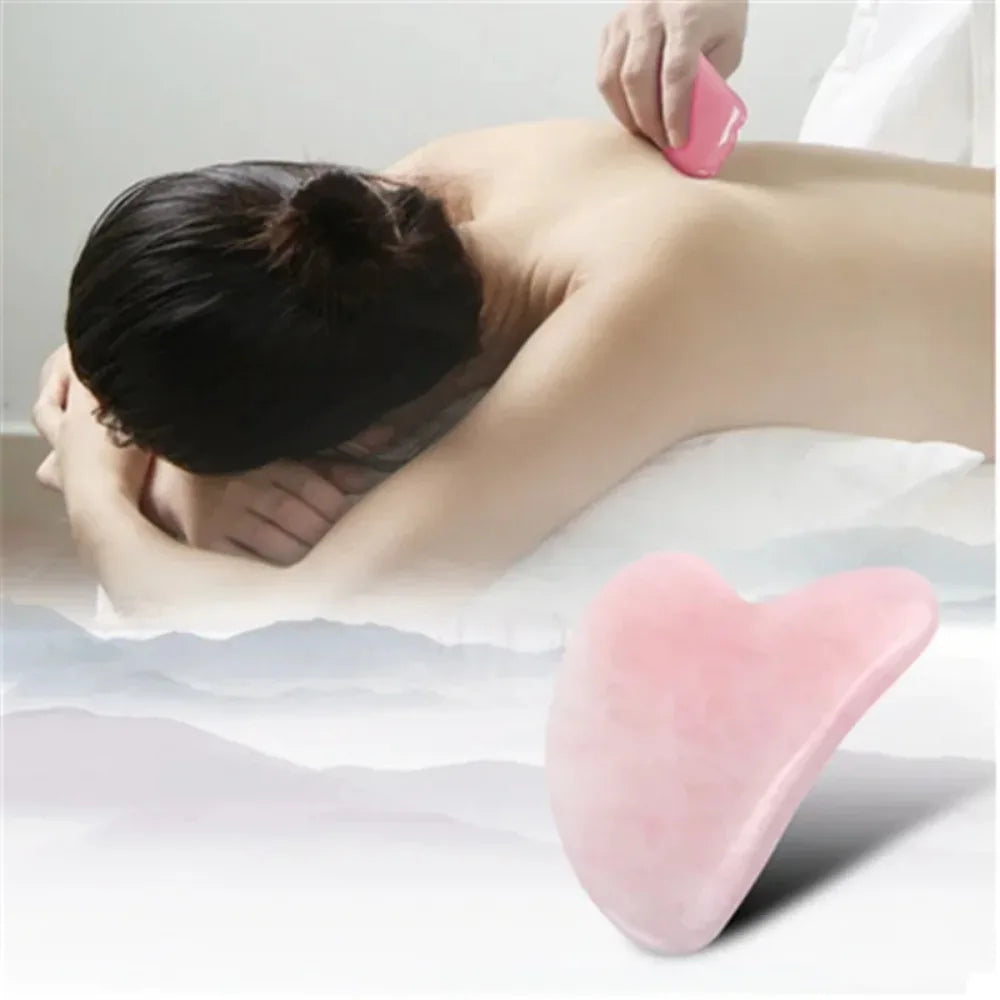 Rose quartz gua sha stone gliding on neck and shoulder during massage