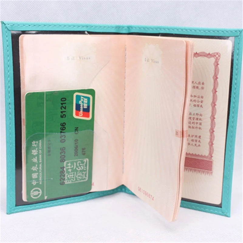 Teal passport sleeve with card slots shown inside; “PASSPORT” lettering on front