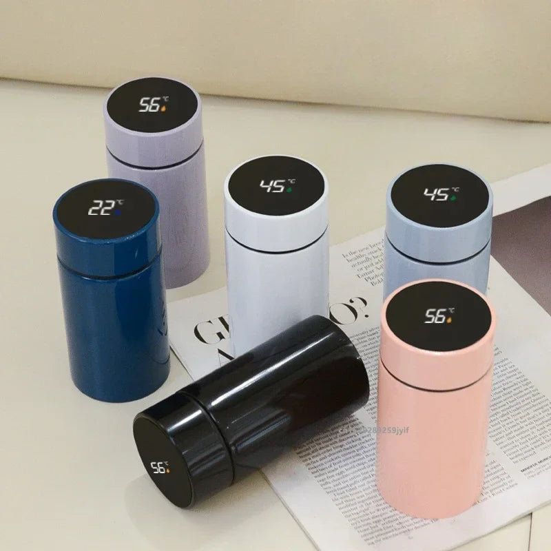 Smart compact thermos set with temperature displays: dark blue, white, gray and pink cups