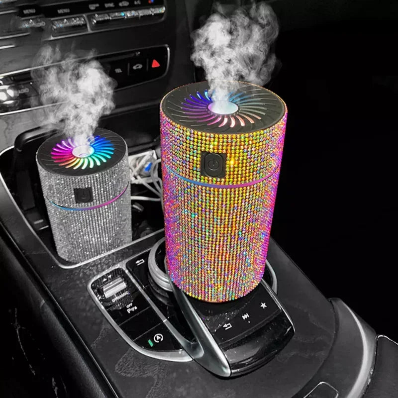 Rainbow and silver rhinestone car aroma diffusers with glowing fan tops and vapor
