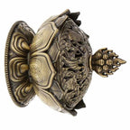 Antique bronze lotus incense burner angled view with engraved lotus panels and finial