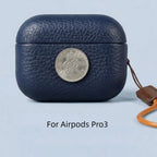 Navy leather AirPods Pro 3 coin case, rear view with wrist strap detail