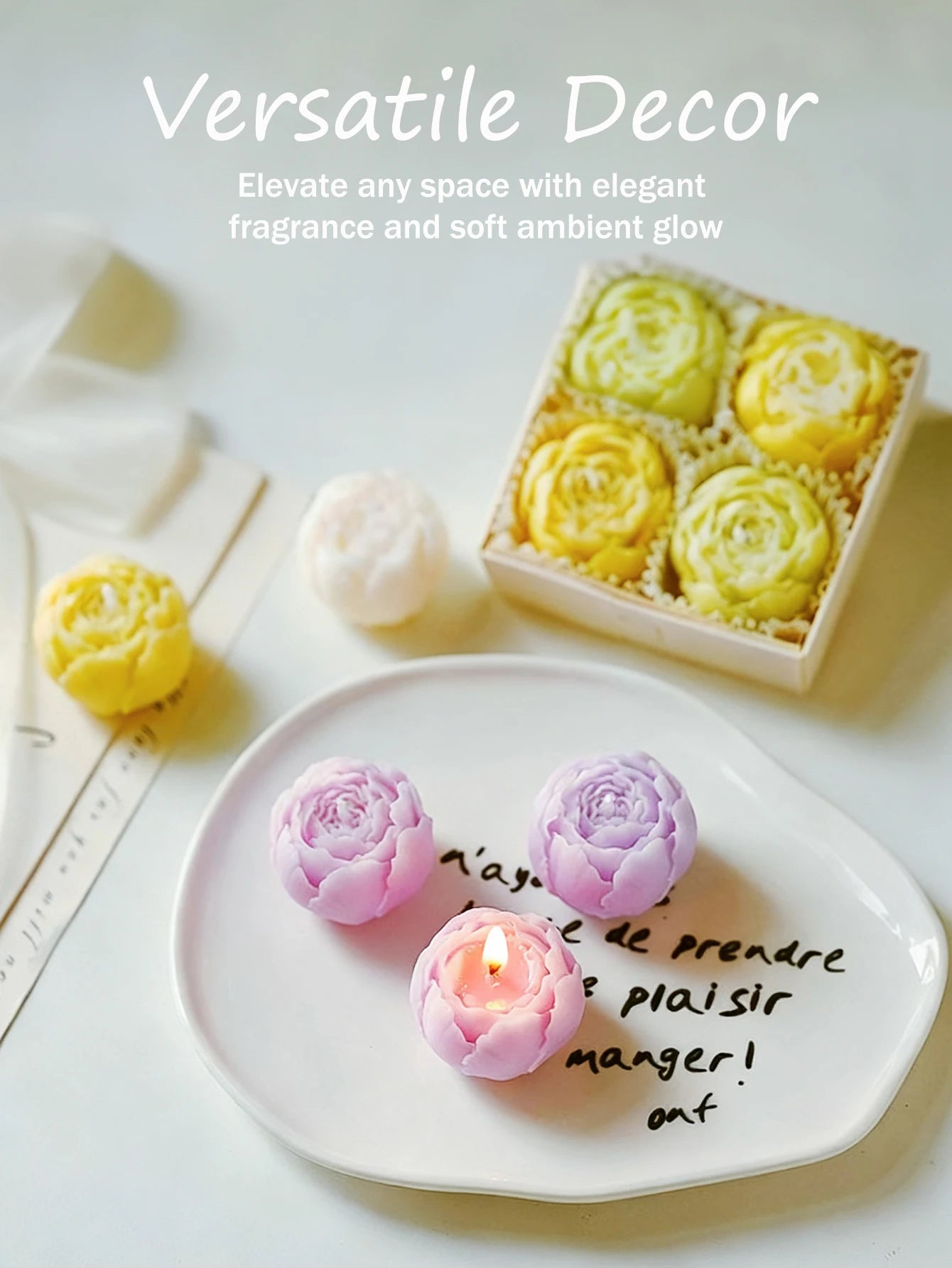 Rose scented candle gift set with purple, pink, and peach rose candles on a plate