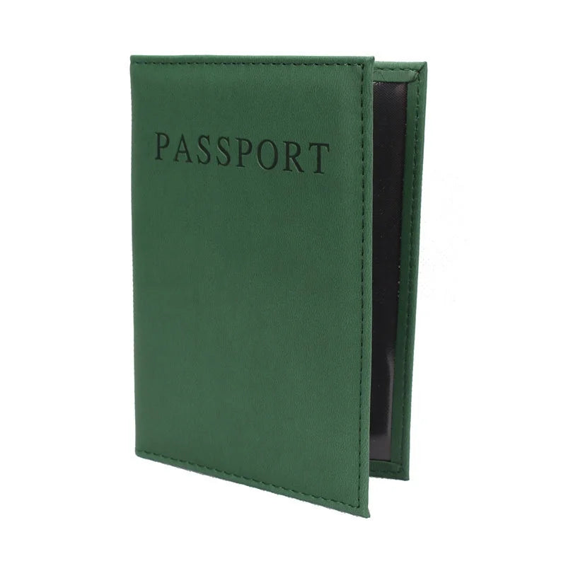 Forest green passport sleeve with embossed “PASSPORT” and dark inner lining