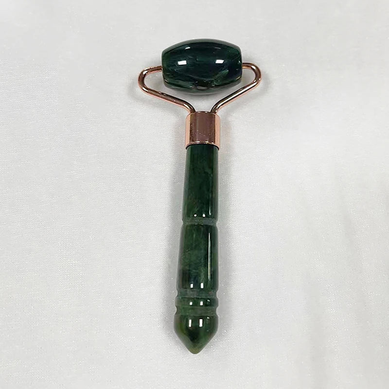 Deep forest green jade roller massager with rose-gold frame