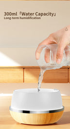 Wood and white aroma diffuser with water being poured into the top opening.