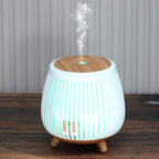 Light wood-grain aroma diffuser humidifier with glowing multicolor LED and mist