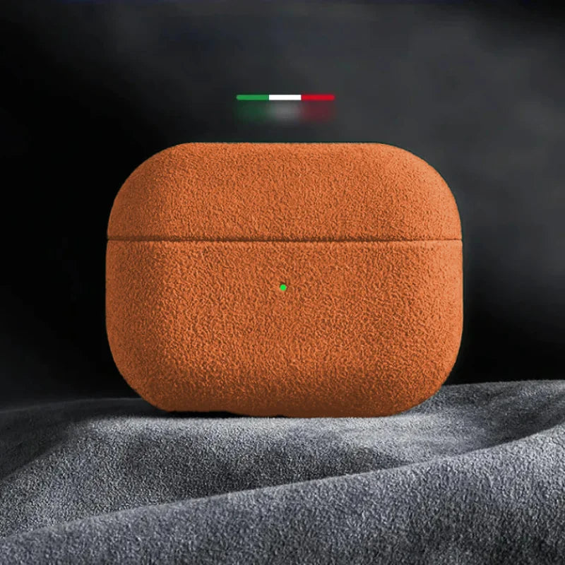 Italian suede AirPods case, amber glow orange finish with central button cutout