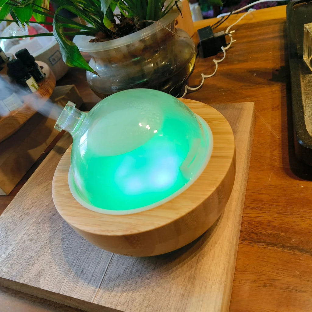 Luxe Glass Dome Aroma Diffuser 200ml with green glow on natural wood base