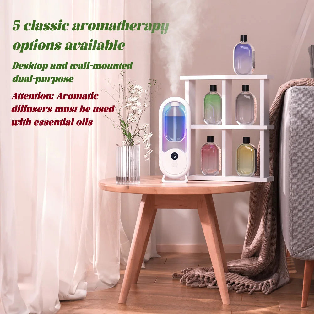 White desktop aroma diffuser with blue light and essential oil bottles on display