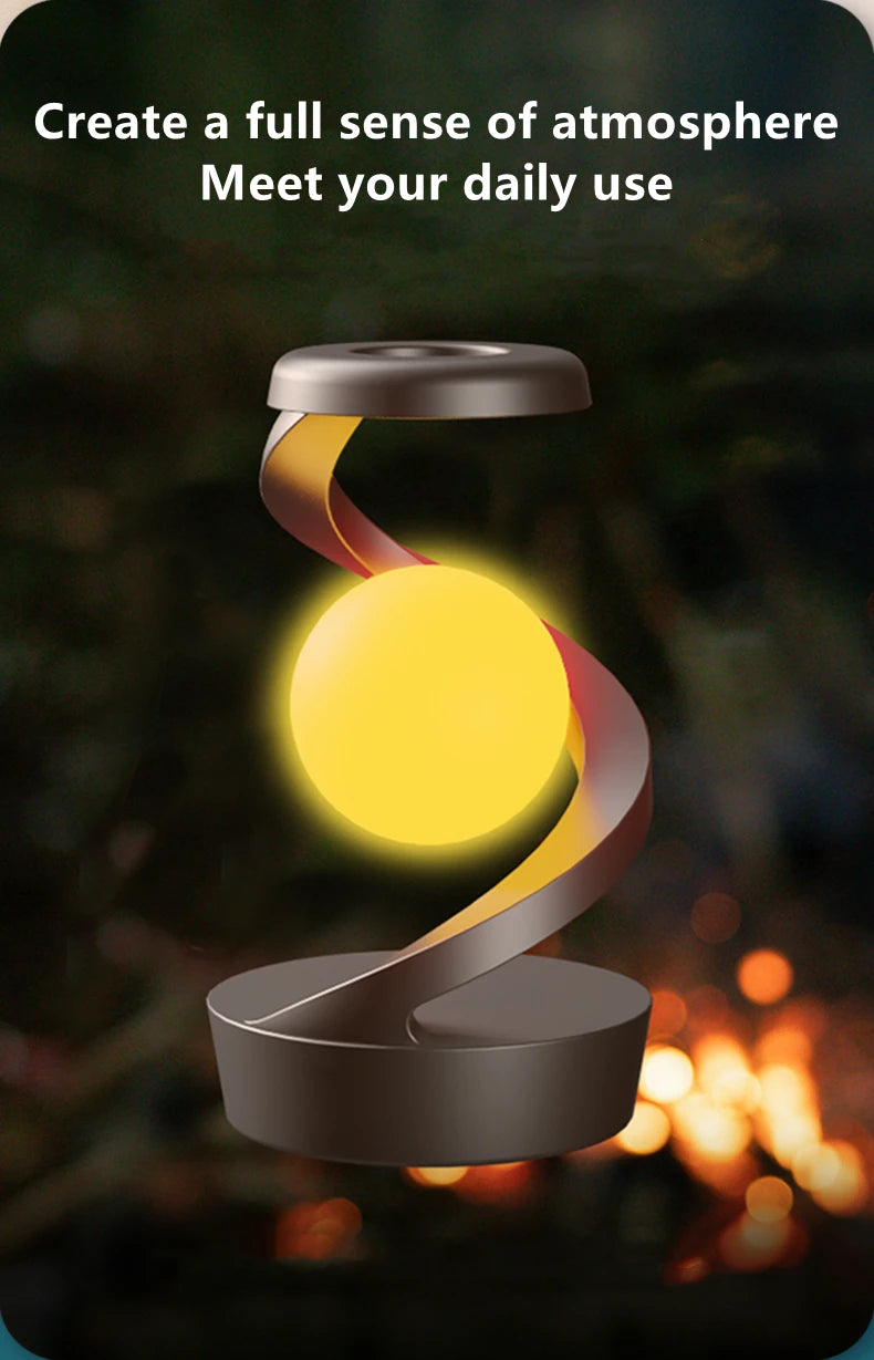 Floating wireless charging lamp with yellow glow and dark base, swirling light arm