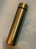 Gold insulated thermos bottle with black top ring
