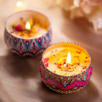 Dried floral aromatherapy candle, patterned tin with lit wick