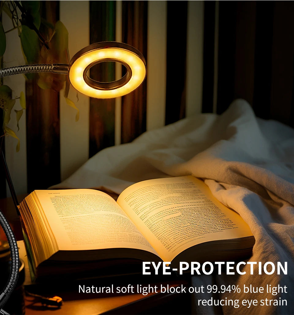 Cordless reading lamp with a glowing circular ring light above an open book