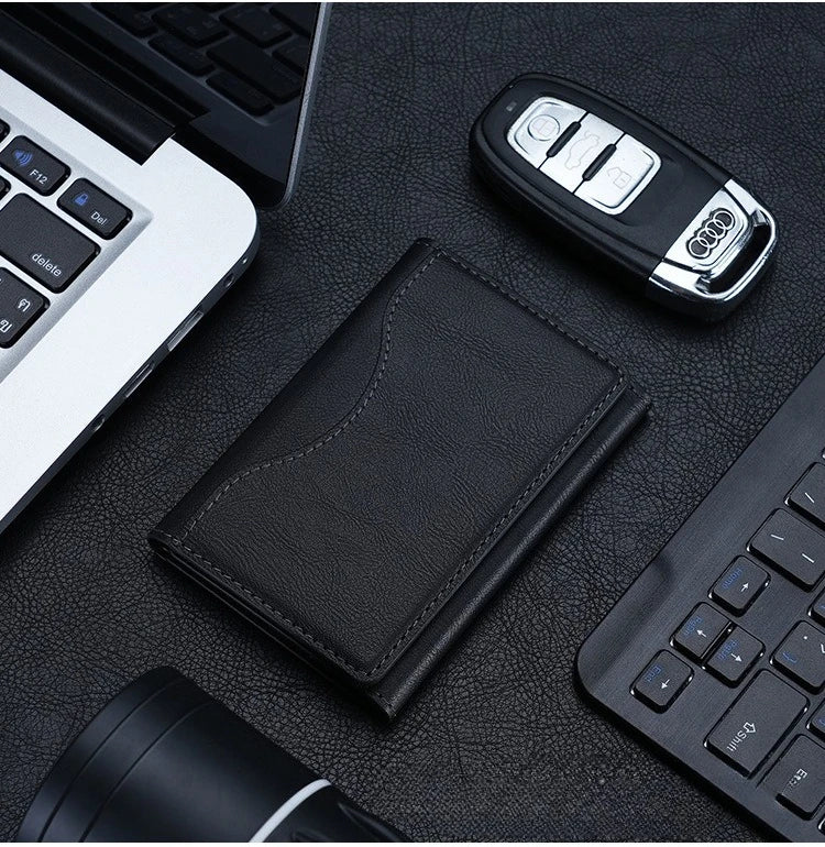 Magnetic pouch wallet in black leather with stitched front, slim fold design