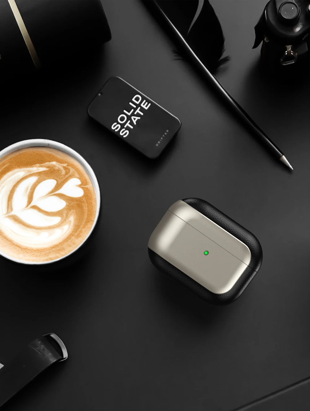 Compact protective case with leather-textured black edge and light gray top, for AirPods Pro