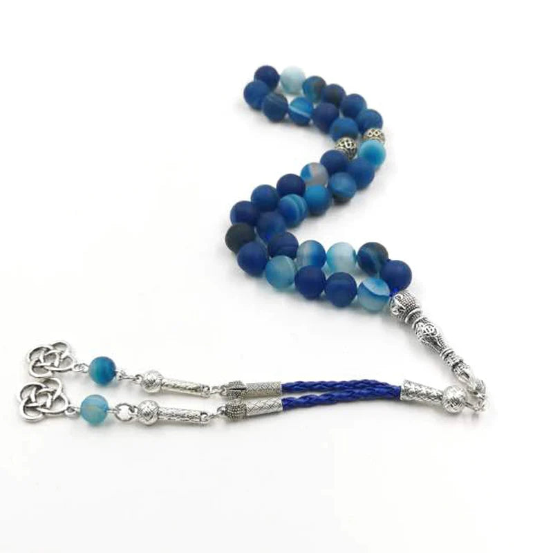 Blue agate prayer bead rosary with silver-tone centerpiece and braided tassel cords