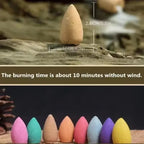 Colorful backflow incense cones standing in a row, tan and blue cones visible