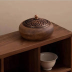 Round solid wood incense tray with decorative metal lid and central knob finial