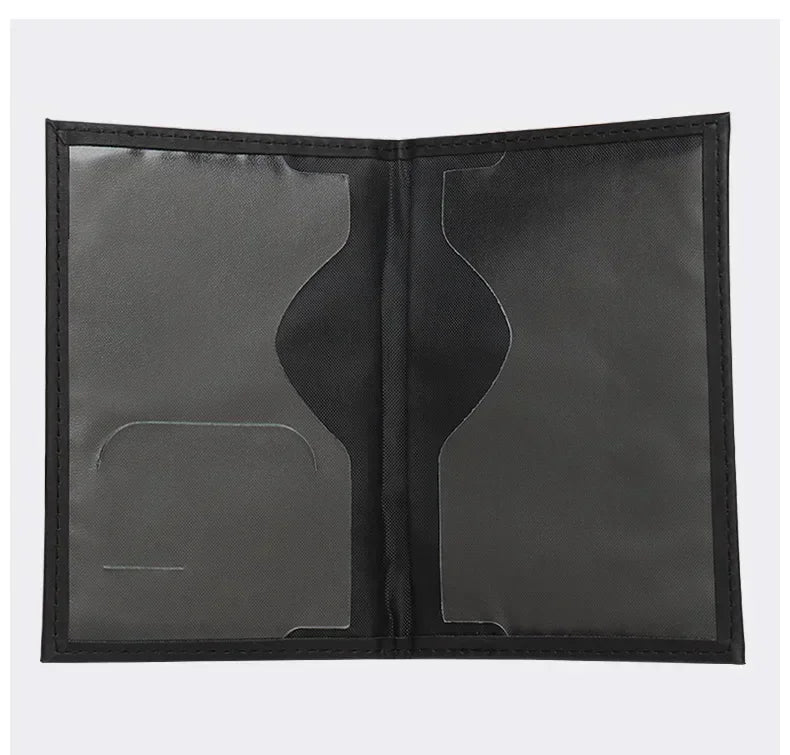 Black passport sleeve interior with two card slots and center pocket panel