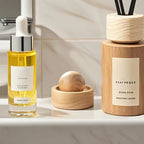 Light wood mini aroma diffuser with carved spherical insert in round holder