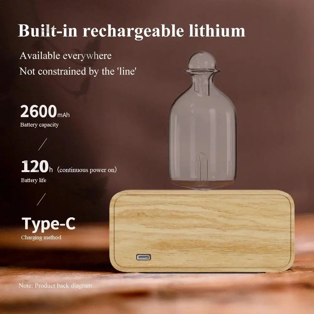 Essential oil diffuser with clear glass bottle and light wood base, Type-C charging port visible