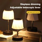 Two cordless LED desk lamps with adjustable telescopic levers and warm black bases