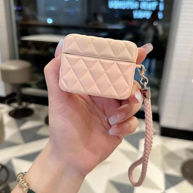 Cream quilted leather AirPods case with lanyard strap and front clasp