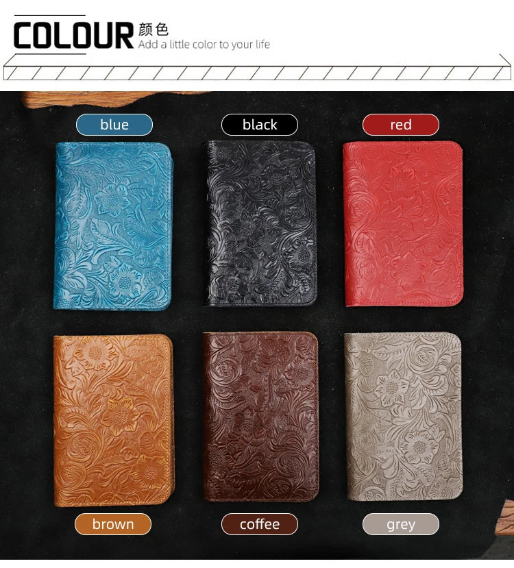 Assorted leather travel folios in blue, black, red, brown, coffee, and grey colors.