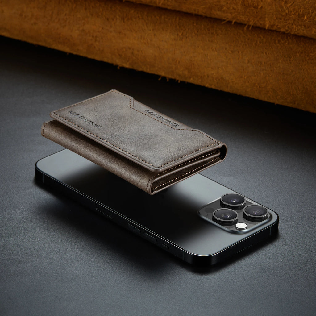Gray slim leather wallet with card slots, attached to a phone, closed