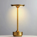 Champagne gold wireless touch lamp with circular top and tall slender base