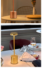 Cordless reading lamp with copper/rose metal base and top, touch-on stand light