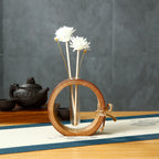 Bamboo Glass reed diffuser bottle: circular bamboo ring around clear glass with white reed stems
