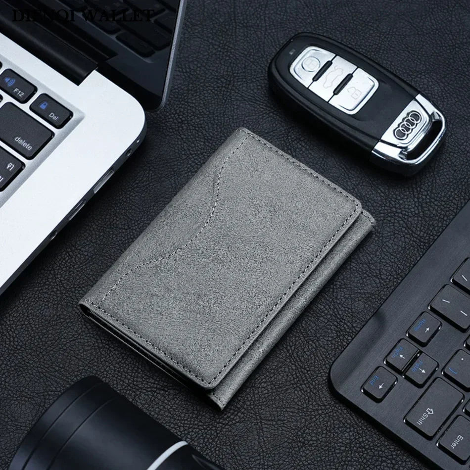 Grey PU leather card holder with stitched edges, front view