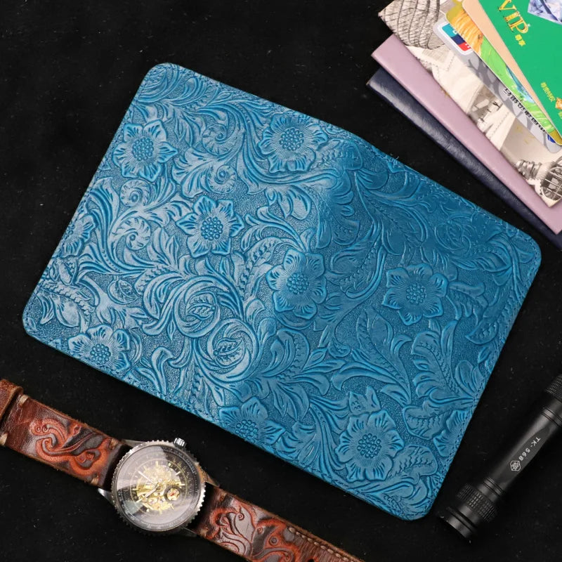 Blue leather travel folio with embossed floral pattern, slim passport-card holder