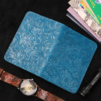 Blue leather travel folio with embossed floral pattern, slim passport-card holder
