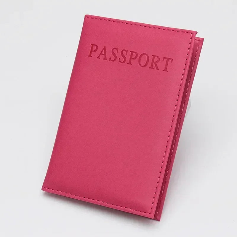 Munchy pink classic travel passport sleeve with “PASSPORT” text