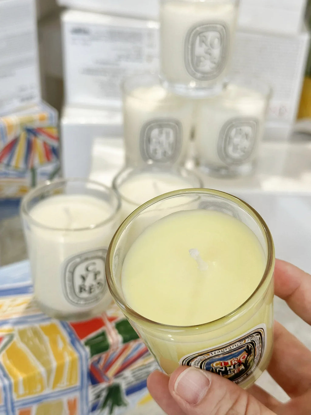 Single pale yellow French Botanical scented candle in clear glass with lid