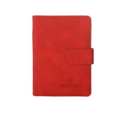 Red passport folio with stitched border and snap strap, embossed airplane and “PASSPORT”