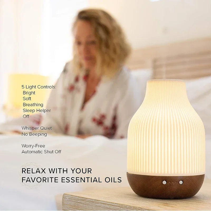 White ribbed ceramic aroma diffuser with warm-lit base and front control panel