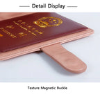 Close-up of passport folio with textured magnetic buckle and luggage tag loop strap