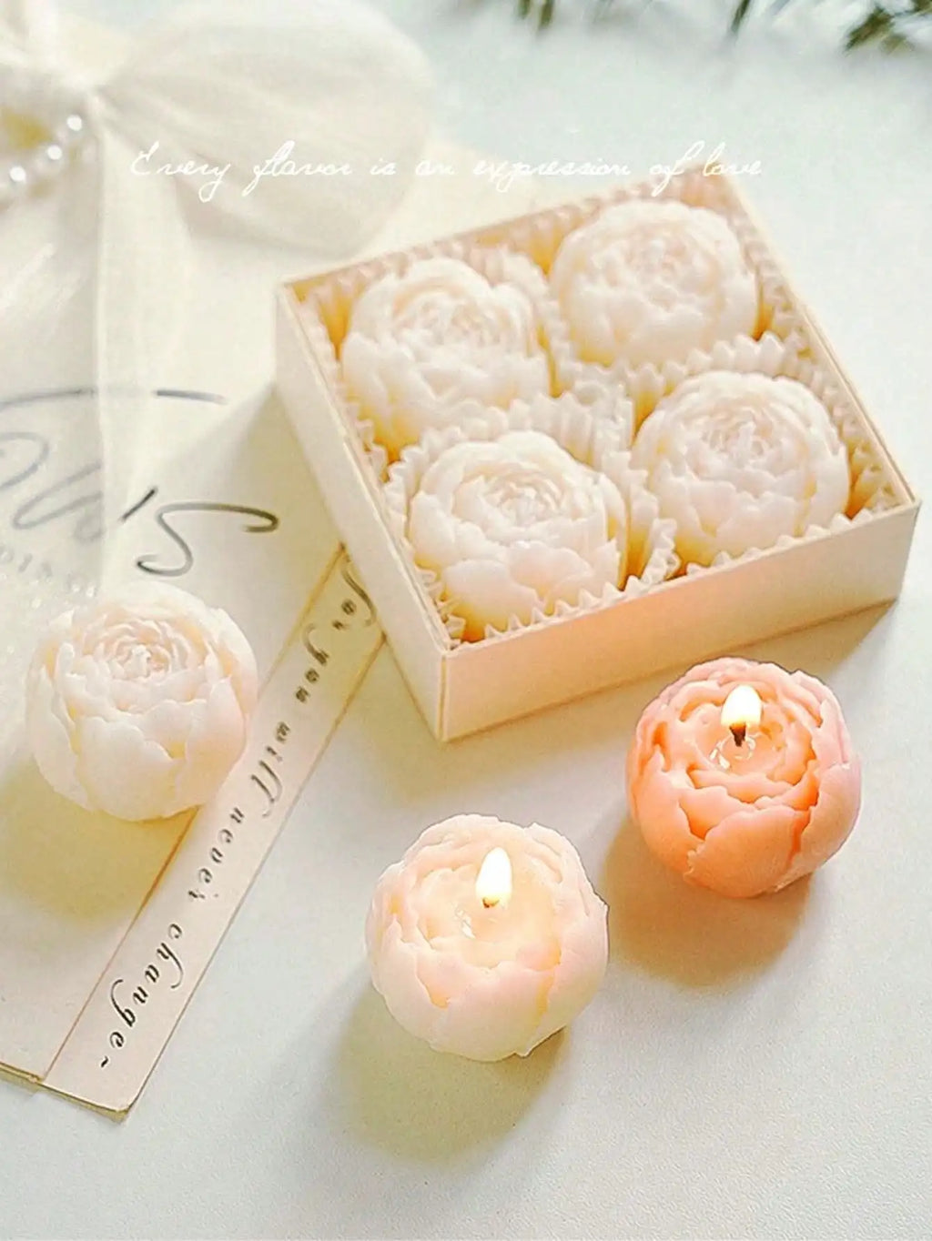 Floral candle set: ivory and peach rose candles with wicks on light surface