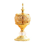 Gold incense tower holder with ornate cylinder, clear crystal base, and scalloped stand
