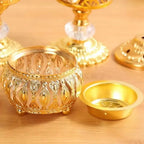 Close-up of gold incense bowl with cutwork pattern and attached dish insert