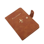 Cognac brown passport cover with “PASSPORT” text and airplane emblem