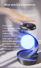 Hand controls RGB wireless charging lamp with blue glow and bright white orb on base