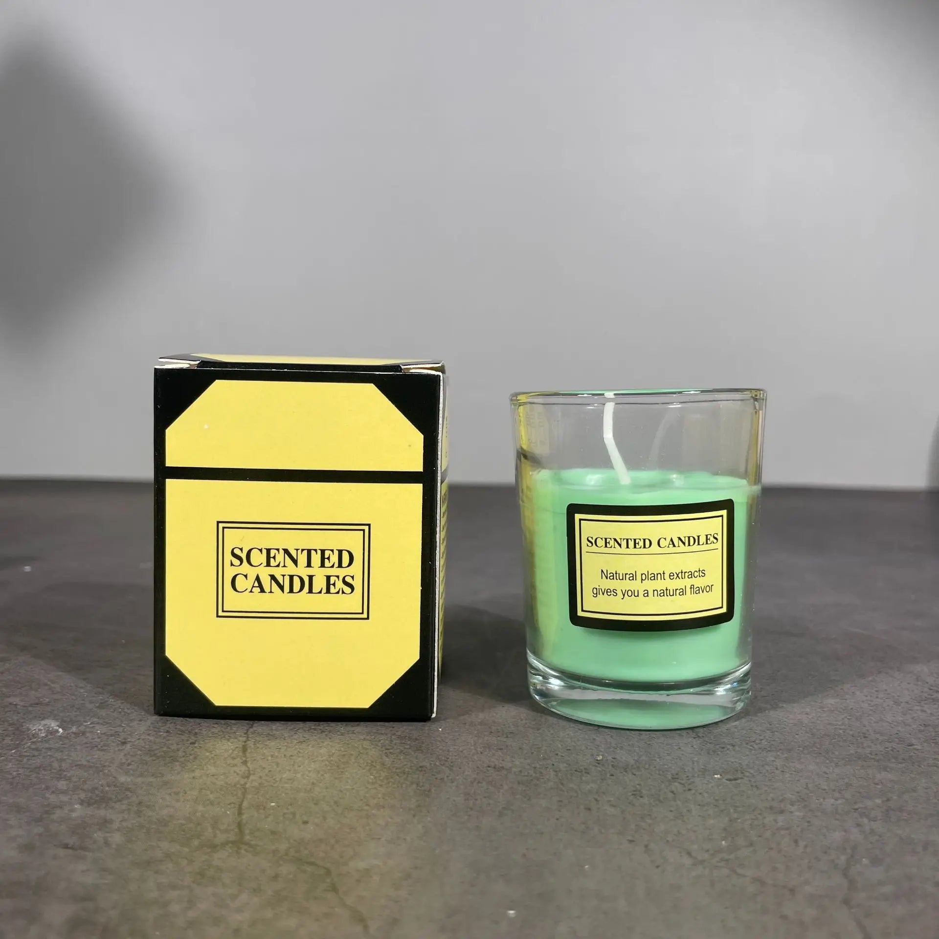 Romantic aromatherapy candle in glass with green wax; gift box labeled Scented Candles